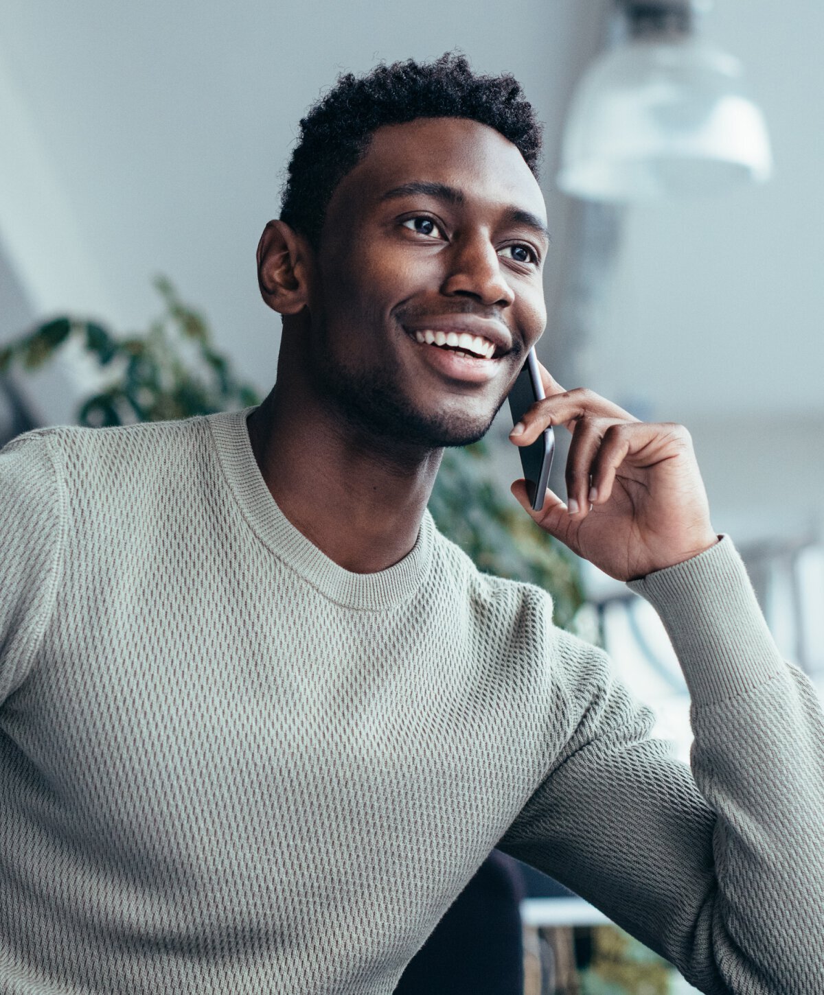 Chevy Chase regenerative medicine model holding a cellphone